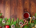 Christmas and Happy New Year background with tea. Top view, copy space. Fir branches, brown dark wooden table Royalty Free Stock Photo