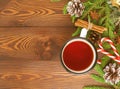 Christmas and Happy New Year background with tea. Top view, copy space. Fir branches, brown dark wooden table Royalty Free Stock Photo