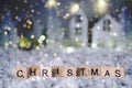 Christmas and Happy new year 2019. Christmas word from letters over blur bokeh background with copy space for text and snowfall.