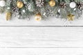 Christmas or Happy New Year composition made of fir tree branches, holiday silver and golden decorations Royalty Free Stock Photo