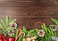 Christmas and Happy New Year dark brown background. Top view, copy space, wooden rustic table, fir branches