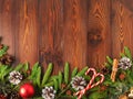 Christmas and Happy New Year dark brown background. Top view, copy space, wooden rustic table, fir branches Royalty Free Stock Photo