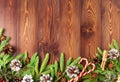 Christmas and Happy New Year dark brown background. Top view, copy space, wooden rustic table, fir branches Royalty Free Stock Photo