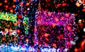 Christmas and happy new year decoration light. Red, neon green, blue, pink bokeh background with beautiful pattern. Defocused Xmas Royalty Free Stock Photo