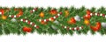 Christmas and happy New Year garland and border of Christmas tree branches decorated with holly Berries and silver baubles, stars Royalty Free Stock Photo