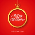 Christmas and Happy New Year greeting card with handwritten inscription Merry Christmas, golden christmas ball and red background. Royalty Free Stock Photo