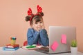 Christmas and Happy new year online. Excited School Girl at laptop isolated background in studio. Christmas child write letter to