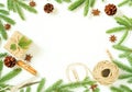 Christmas and Happy New Year white background. Gift Christmas box, fir branches, wooden table, top view, copy space Royalty Free Stock Photo