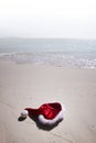 Christmas hat on beach Royalty Free Stock Photo
