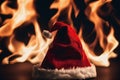 Christmas hat on fire on the floor, xmas background