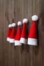 Christmas hats of Santa Claus. Christmas tree toys handmade. Christmas ornaments. Little Santa Claus hats. Royalty Free Stock Photo