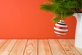 Christmas holiday background with bauble decoration and fir tree branches on wooden table Royalty Free Stock Photo