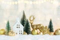 Christmas holiday background with decorative golden balls and bells, snowflake and deer