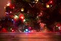 Christmas holiday background with empty wooden deck table over bokeh. Royalty Free Stock Photo