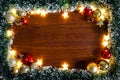 Christmas holiday background with empty wooden deck table over winter bokeh. Royalty Free Stock Photo