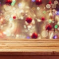 Christmas holiday background with empty wooden deck table over winter bokeh Royalty Free Stock Photo