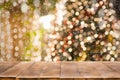 Christmas holiday background with empty wooden table top over festive bokeh light Royalty Free Stock Photo
