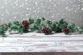 Christmas holiday background with empty wooden white table and Christmas festive lights