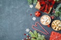 Christmas holiday background with gift boxes and hot chocolate cup on blackboard Royalty Free Stock Photo