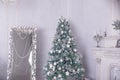 Christmas holiday background. Christmas tree with silver and white decoration. Beautiful Christmas tree closeup Royalty Free Stock Photo