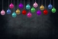 Christmas Holiday Balls ornaments in the class of school on blackboard background. picture copy space for art work design ad or ad Royalty Free Stock Photo