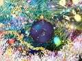 Christmas blue   ball on green tree and confetti illumination blurred light holiday background greetings card Royalty Free Stock Photo