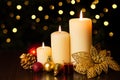 Christmas holiday card with three burning candles and ornaments with bokeh light Royalty Free Stock Photo