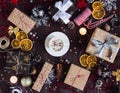 Christmas holiday coffee cup drink gift box on decorated festive table with pine cones candy cane candle Royalty Free Stock Photo