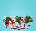 Christmas Holiday Composition. New Year Gift in White Box with Red Ribbon Fir Tree Branches Star Anise Marshmallows Royalty Free Stock Photo