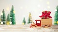 Christmas holiday concept with toy truck car and gift box on wooden table background Royalty Free Stock Photo