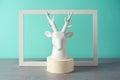 Christmas holiday concept with white reindeer. Winter season modern still life composition