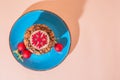 Christmas holiday cookies homemade sweet dessert on a blue plate and attributes symbols of the New Year top view on a peach color