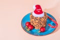 Christmas holiday cookies homemade sweet dessert on a blue plate and attributes symbols of the New Year top view on a peach color