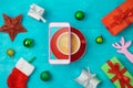 Christmas holiday creative concept with coffee cup, smart phone Royalty Free Stock Photo