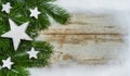 Christmas stars background with white snow frame and fir branches Royalty Free Stock Photo