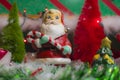 Christmas holiday decorations scene Santa close up and red and green tree