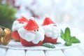 Christmas holiday dessert. Strawberry Santa stuffed with whipped cream Royalty Free Stock Photo