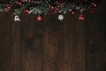 Christmas Holiday Evergreen Pine Branches and Red Berries Over Wood Background, Copy Space Royalty Free Stock Photo