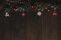 Christmas Holiday Evergreen Pine Branches and Red Berries Over Wood Background, Copy Space Royalty Free Stock Photo