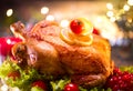 Christmas holiday family dinner. Decorated table with roasted turkey