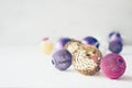 Christmas holiday festive theme with golden pink violet ball LED garland and gold and purple Christmas ornament Royalty Free Stock Photo