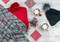 Christmas holiday background with hot cocoa, gift boxes and women`s winter clothing