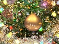 Christmas   holiday gold  ball on green tree and confetti illumination blurred light holiday background greetings card Royalty Free Stock Photo