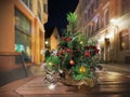 Christmas street  green   tree on  wooden  table top and street time  and  street time  in old town of Tallinn holiday in Estonia Royalty Free Stock Photo