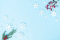 Christmas holiday and happy new year winter composition and snowflakes decoration on blue background, flat lay Royalty Free Stock Photo