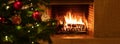 Christmas tree close up on burning fireplace background Royalty Free Stock Photo