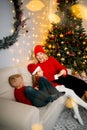 Happy young family with kids having fun celebrating christmas. Christmas time at home. Royalty Free Stock Photo