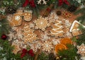 Christmas Holiday and New Year decorations with elements of gingerbread cookies, Christmas tree branches, cones, dried oranges and Royalty Free Stock Photo