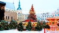 Christmas holiday in old town of Tallinn decoration blurring silver illuminating light ruffled red towers gate cityscape christmas