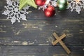 Christmas Holiday Ornaments and Christian Cross on a Dark Wood B
